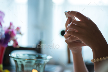 Photodune Young woman holding phone in her hands 18780134