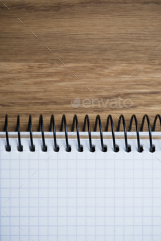 Photodune Notebook on a wooden table 18783864
