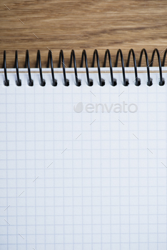 Photodune Notebook on a wooden table 18783862