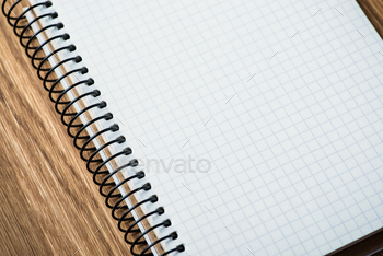 Photodune Notebook on a wooden table 18783869