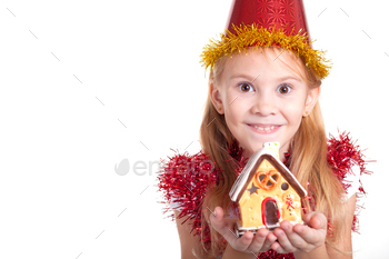 Photodune Happy little smiling girl with christmas house. 18788075