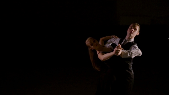Videohive Young Dancers Dancing In The Studio Over Black Background 18856191