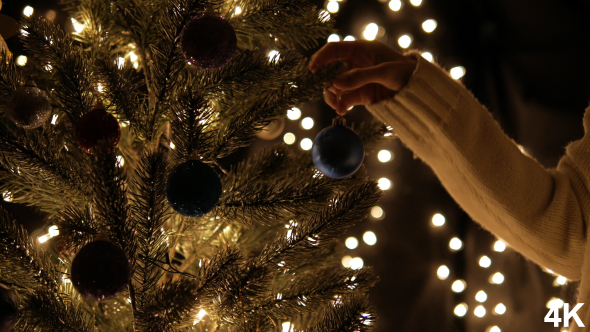 Decorating Christmas Tree With Ball