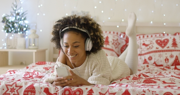 Attractive Young Woman Relaxing at Christmas