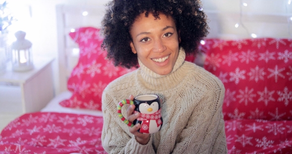 Happy Young Woman Relaxing at Christmas