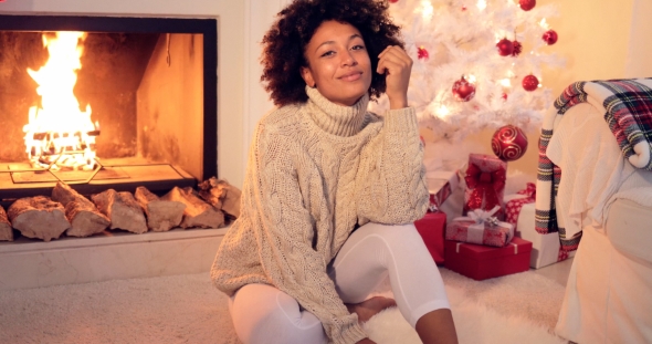 Woman By Fireplace and White Christmas Tree