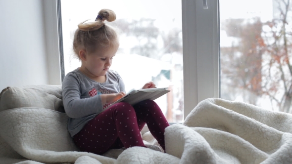 Videohive Little Girl with a Tablet 19047626