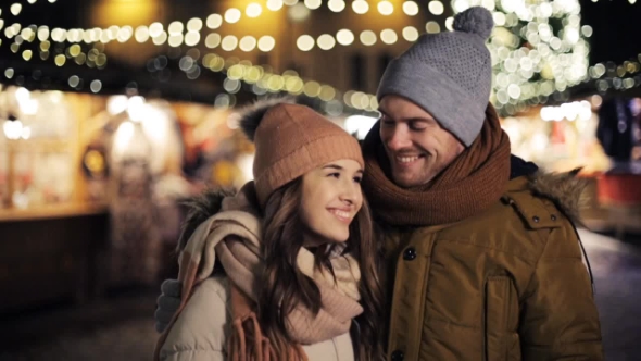 Happy Couple Hugging at Christmas Market