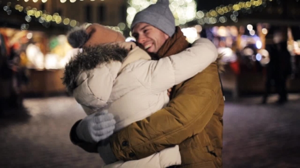 Happy Couple Meeting and Hugging on Christmas