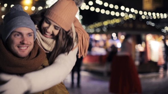 Happy Couple Dating and Hugging on Christmas