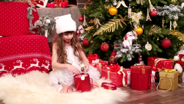 Little Girl with Gifts, Christmas Surprise, A Child Plays in the House on Christmas Eve, Child