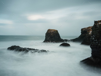 Water gushing over the rocks in a long exposure in iceland