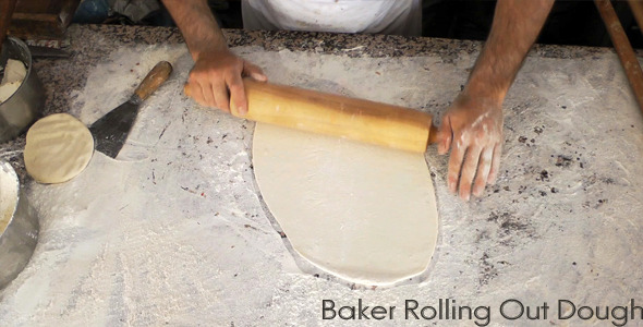 Baker Rolling Out Dough Baker Rolling Out Dough
