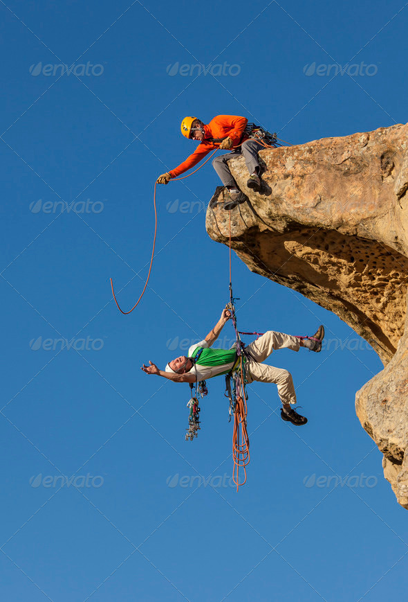 Climbing team struggles to the summit.