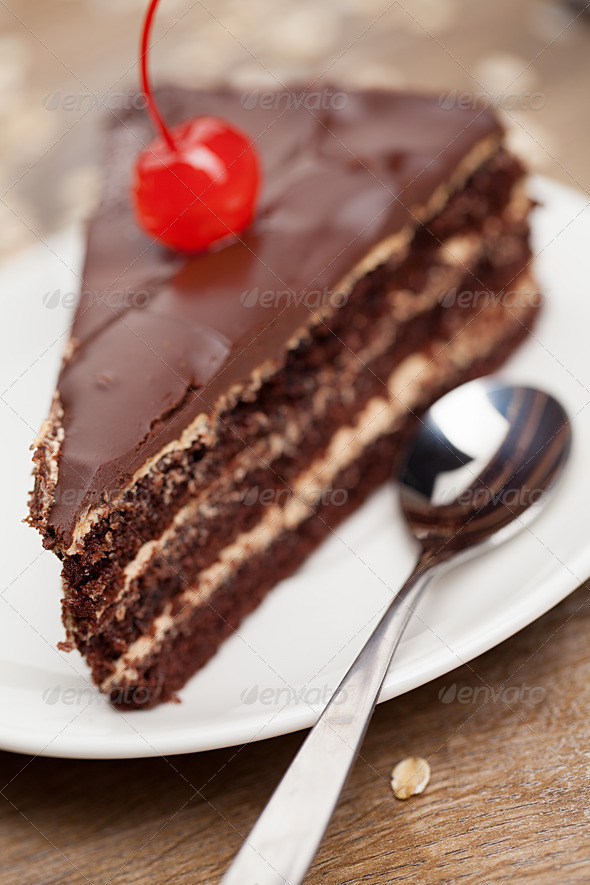 slice of chocolate cake with cherry