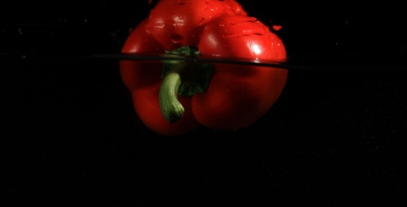 Red Pepper In Water On Black Red Pepper In Water On Black
