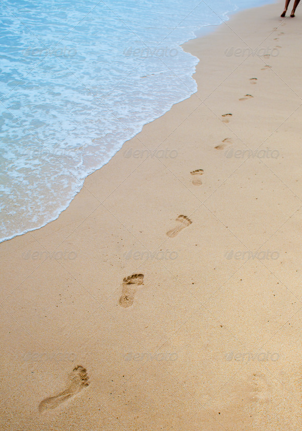 Footprints on sand of sea beach