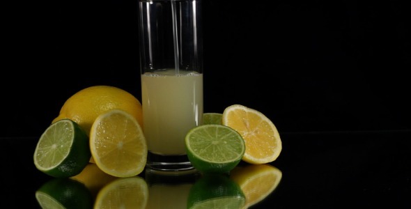 Pouring Citrus Juice on Black Pouring Citrus Juice on Black