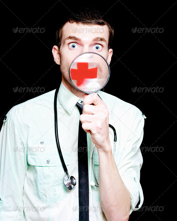Surprised Doctor Showing Health Care Cross - Stock Photo - Images