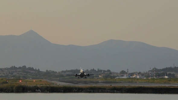 Take-off of Airplane in Corfu Airport at Night 2 Take-off of Airplane in Corfu Airport at Night 2