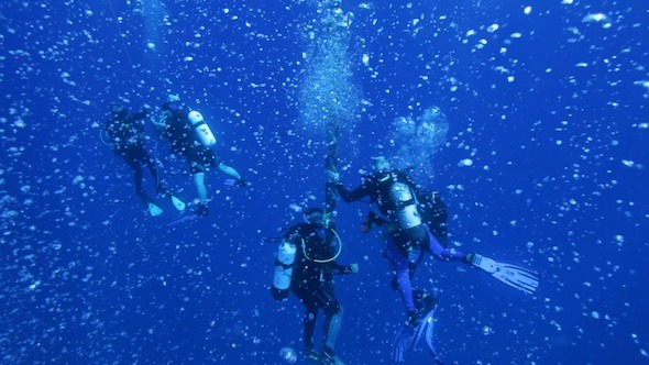 Group Of Divers With Many Air bubbles Group Of Divers With Many Air bubbles