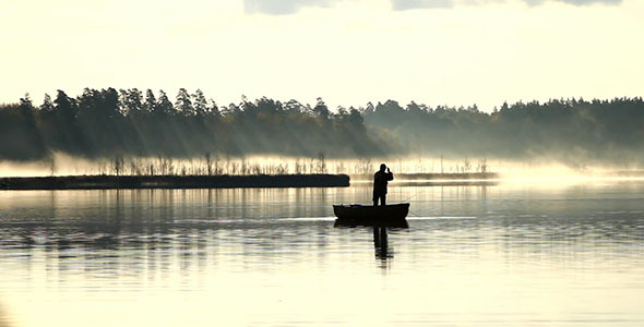 Spin Fishing From Wooden Boat In The Fog Spin Fishing From Wooden Boat In The Fog