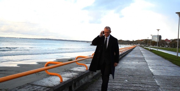 Busy Senior Businessman by Seaside 2 Busy Senior Businessman by Seaside 2