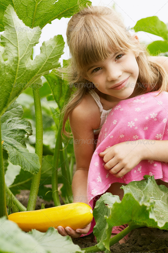The young girl is in the garden