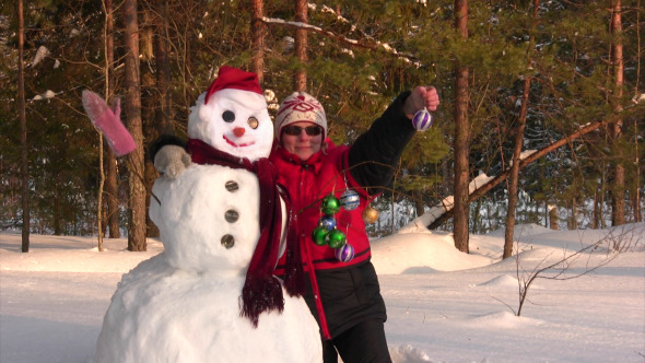 Woman Poses With Snowman Woman Poses With Snowman