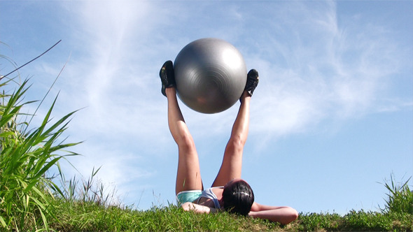 Young Woman Exercising With Ball Young Woman Exercising With Ball