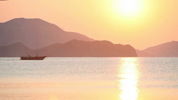 Sailing Boat In The Sea At Sunrise Sailing Boat In The Sea At Sunrise