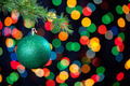 Photo of Lighted Christmas garland on a branch | Free christmas images