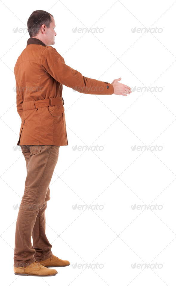 back view of businessman in movement reaches out to shake hands - Stock Photo - Images