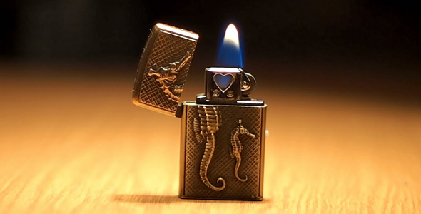 Burning Small Pocket Lighter On Table 1 Burning Small Pocket Lighter On Table 1