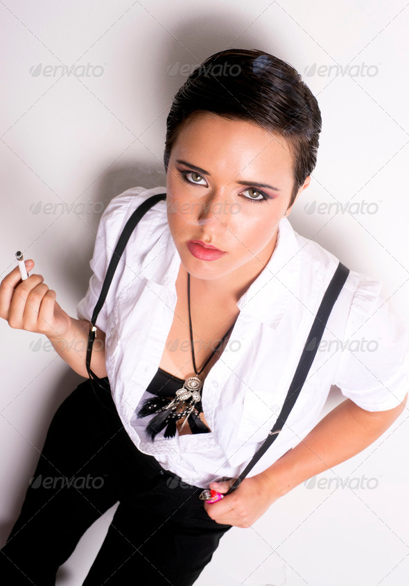Female Smoker Leans Against The Wall