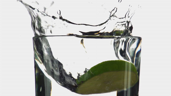 Lime and Tomato Dropped into Water Lime and Tomato Dropped into Water