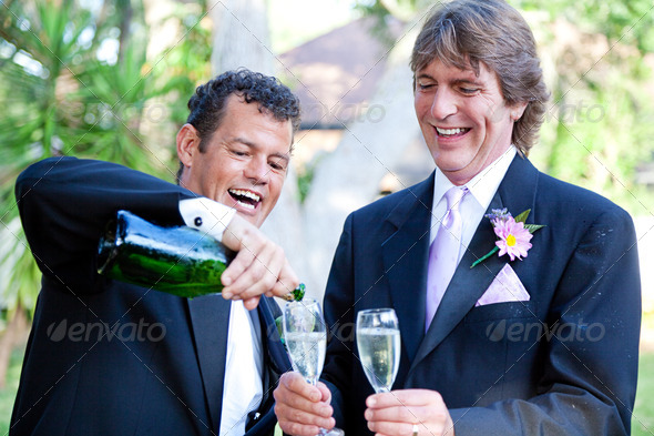 Gay Couple - Champagne Splash - Stock Photo - Images
