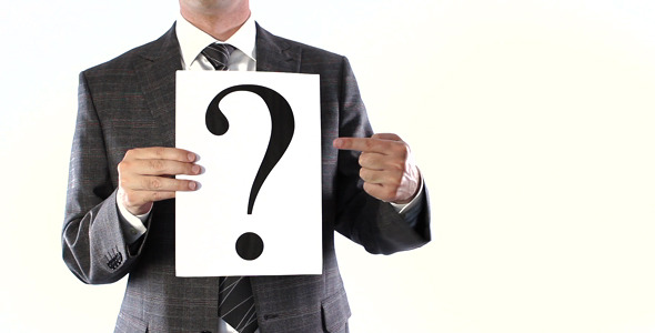 Businessman Showing In To Question Mark Businessman Showing In To Question Mark
