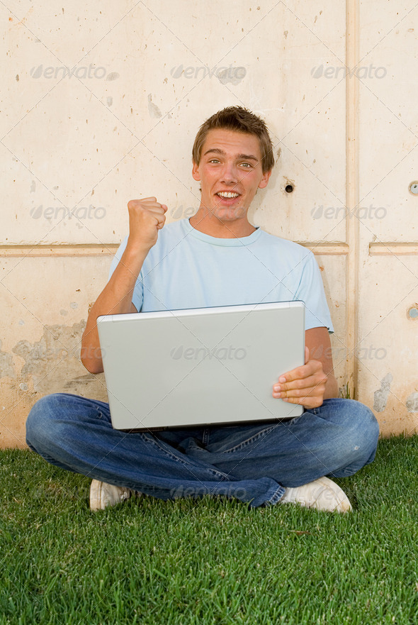 happy student with laptop computer