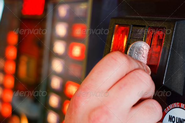 Inserting coins into Gaming machine