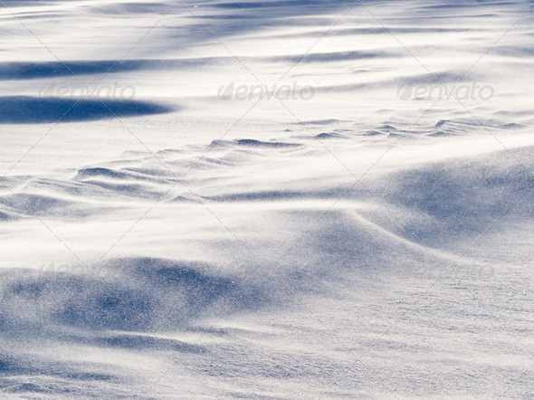 Wind drift snow flying over snow surface refief