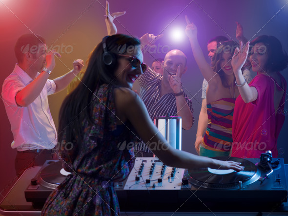 females dj spinning records at party