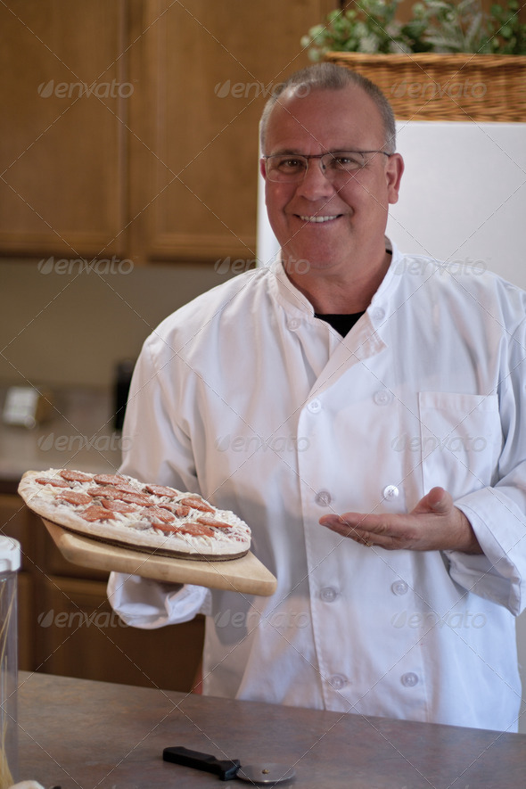 chef presenting frozen pizza