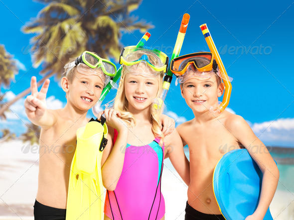 Portrait of the happy children enjoying at beach - Stock Photo - Images