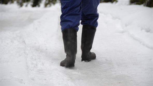 Man Walking On Snowy Road Man Walking On Snowy Road