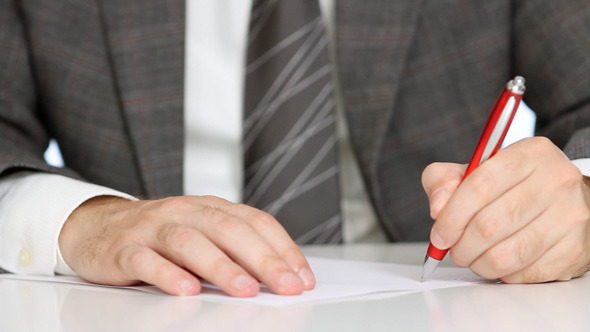 Businessman Writing Application Form Businessman Writing Application Form