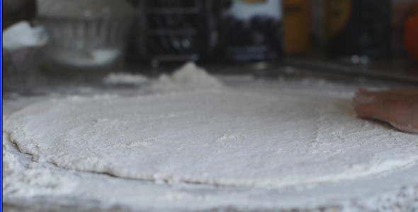 Cook Rolls Out Pizza Dough With A Rolling Pin Cook Rolls Out Pizza Dough With A Rolling Pin