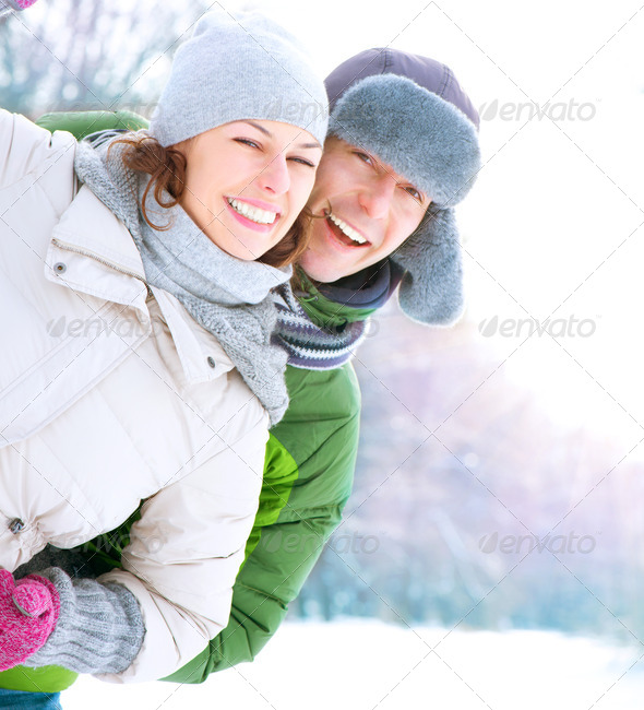 Happy Couple Having Fun Outdoors. Snow. Winter Vacation