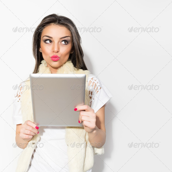 Young hipster brunette woman using digital tablet - Stock Photo - Images