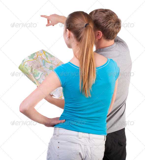 Back view journey of the young couple looking at the map - Stock Photo - Images